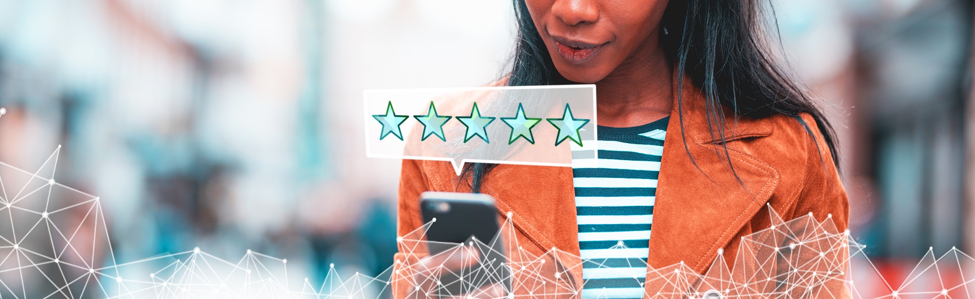 woman viewing phone with five star icon above