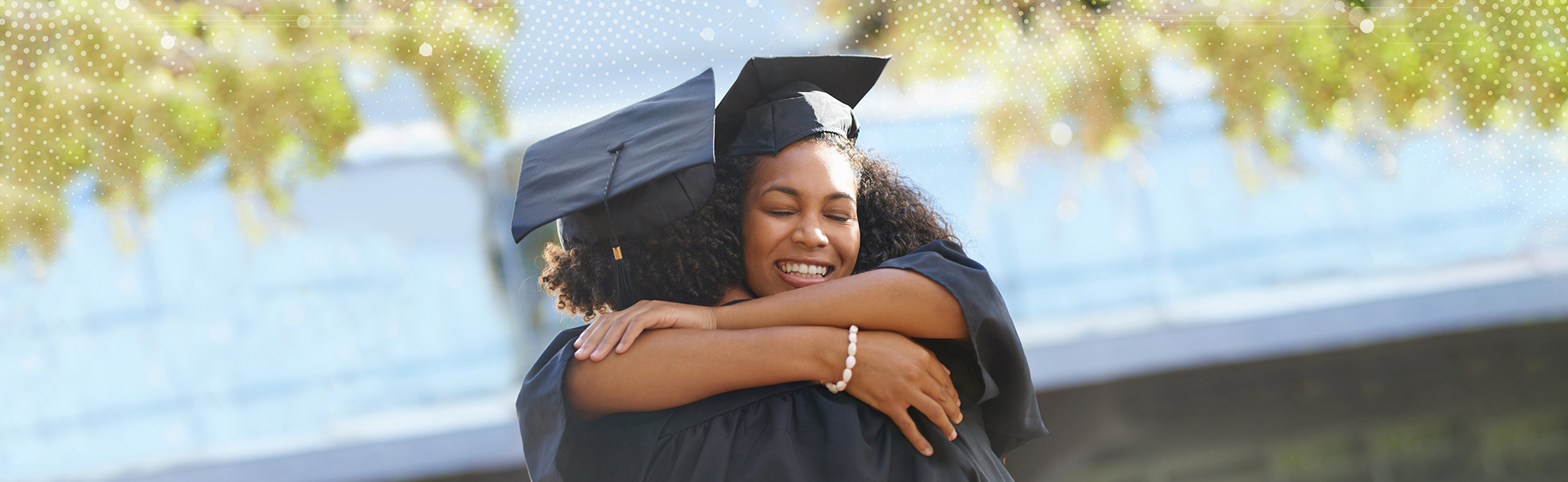 Students hug on graduation day