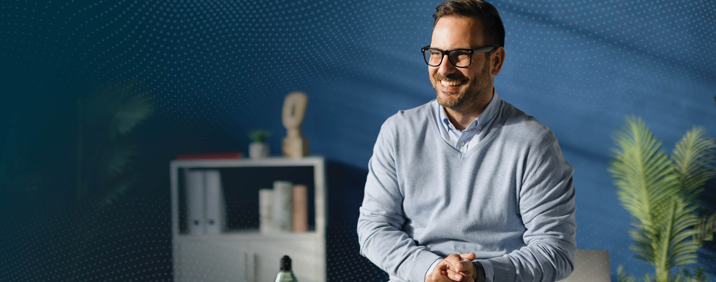 Higher ed CFO smiling in their personal office