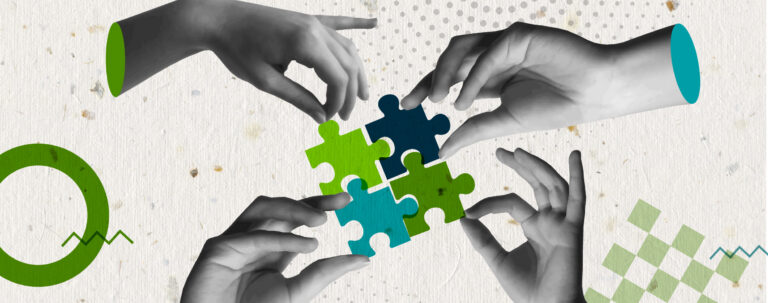 four hands placing different colored puzzle pieces together