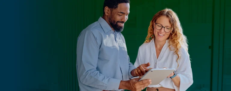 Two higher ed leaders reviewing a document together
