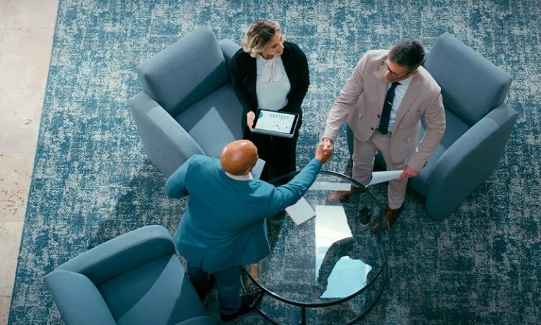 aerial view of higher ed executives meeting in a lobby area